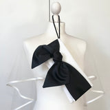 Ivory wedding day bridal handbag with a large black bow