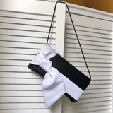 black and ivory evening bag with satin bow