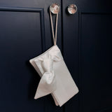 bridal clutch for wedding in ivory satin with bow and a wristlet