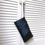 navy satin handbag with wristlet strap