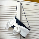 Blue satin evening bag with ivory bow for mother of the bride