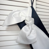 Ivory and navy bow satin clutch evening bag