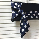 Navy and white polka dot satin clutch handbag PIPER