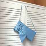 Light blue satin bow clutch handbag PIPER